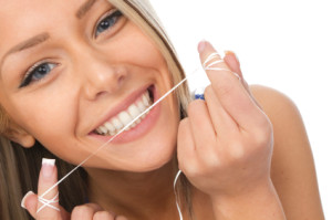Proper flossing habits mechanically remove the plaque and debris from in between the teeth.